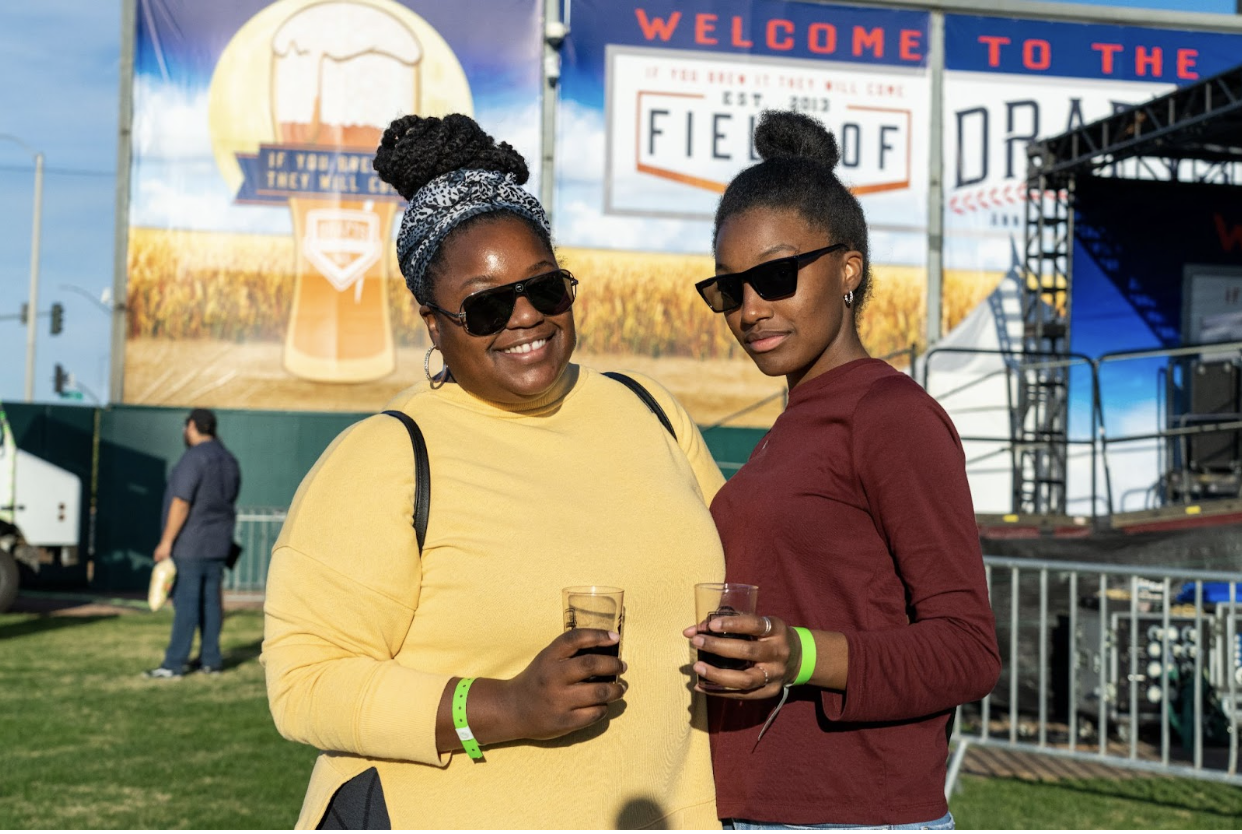 Two women drinking beer and posing at FOD