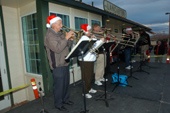 Brass band playing outside over the holiday Hospitality Walk.